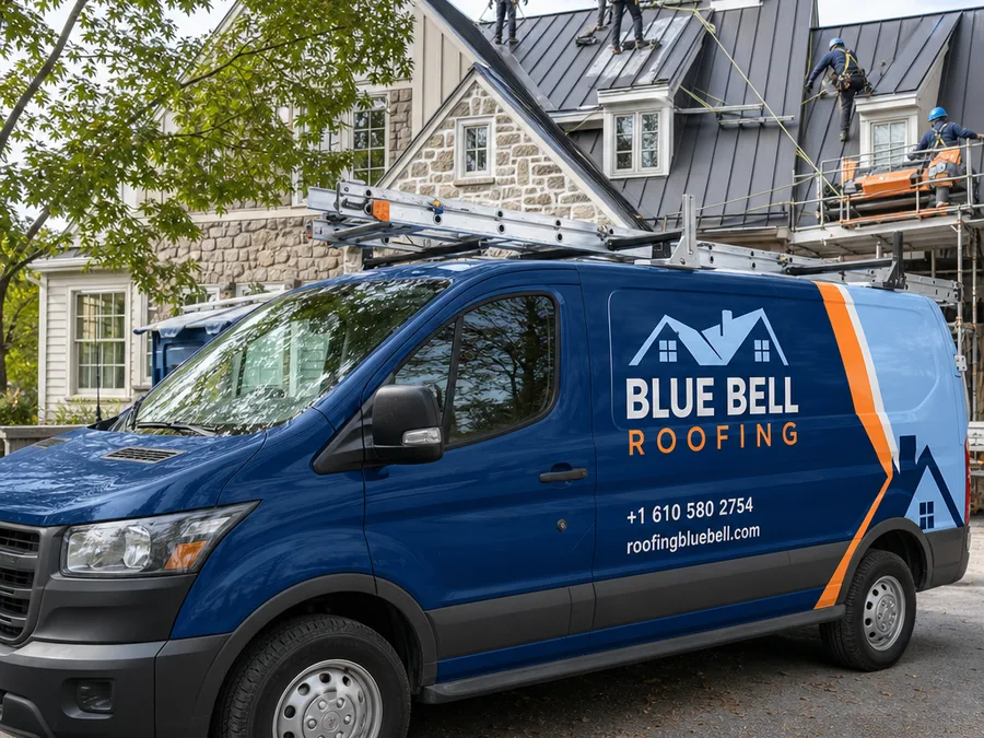 Roofers installing metal panels with fall protection and organized material staging